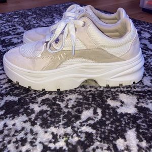 Tan and white chunky sneakers with metal clips